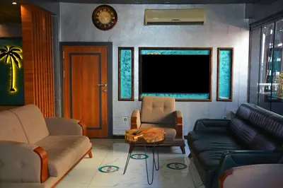 a living room with a couch and a table at palmiye suıt otel in Istanbul