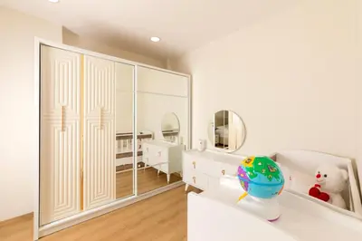 a bedroom with white walls and a large mirror at Algold in Istanbul
