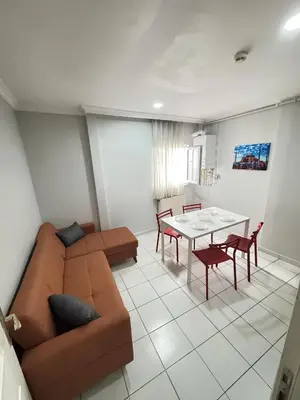 a living room with a couch and a table at Istanbul Family Apartment in Istanbul