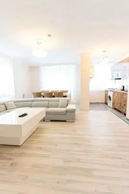 a living room with a couch and a table at Lina Apart in Arnavutköy