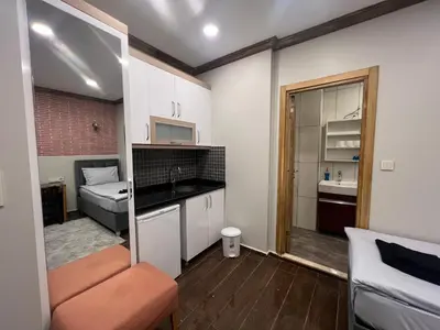 a small apartment with a kitchen and a bedroom at KAMER Apart Hotel in Istanbul