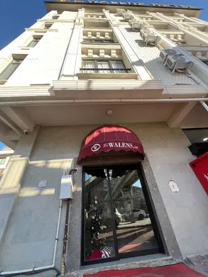 a window of a building with a red awning at The walens hotel in Istanbul