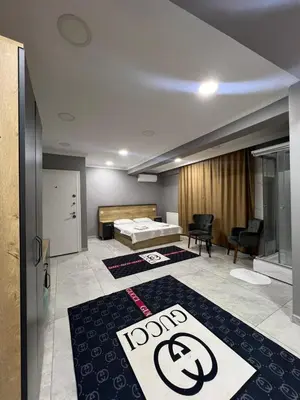 a room with a bed and some rugs on the floor at The walens hotel in Istanbul