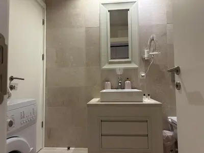 a bathroom with a sink and a shower at Take Me Home in Istanbul