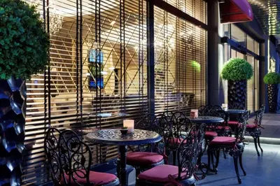 a group of tables and chairs in a restaurant at Icon Hotel Taksim in Istanbul