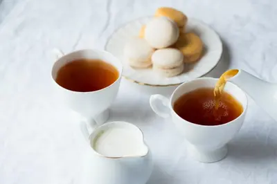 two cups of tea and a plate of cookies at Icon Hotel Taksim in Istanbul