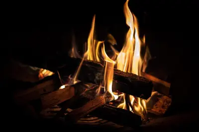 a fire is burning in a fireplace with flames at Icon Hotel Taksim in Istanbul