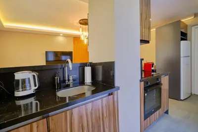 a kitchen with a sink and a counter top at Private Apartment at Beylikdüzü nearly to E5 2 in Beylikduzu
