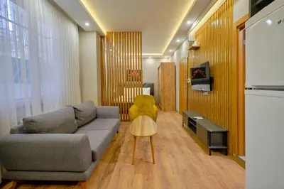 a living room with a couch and a yellow chair at Private Apartment at Beylikdüzü nearly to E5 2 in Beylikduzu