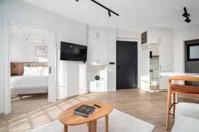 a living room with a bed and a table at Urban Quarters - Firuzağa in Istanbul