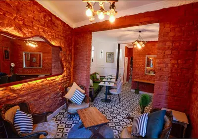 a living room with a brick wall at White Bolshoi Rooms in Istanbul
