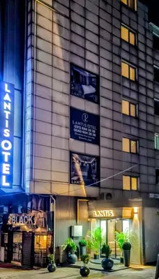 a building with signs on the side of it at Lantis Otel in Avcılar