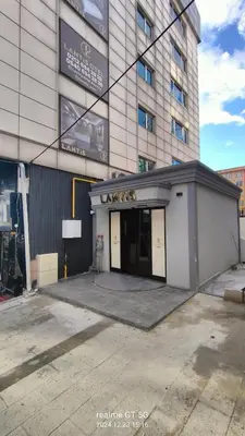 a building with a parking lot in front of it at Lantis Otel in Avcılar