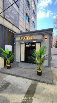 a store front with two plants in front of it at Lantis Otel in Avcılar