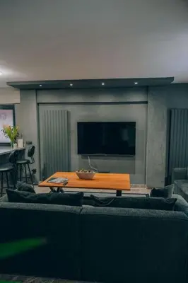 a living room with a couch and a table at Çınar home in Sapanca