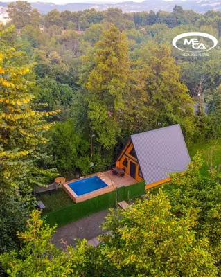 an overhead view of a house with a swimming pool at Meca Deluxe Otel Sapanca in Sapanca