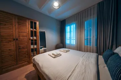 a bedroom with a bed with two towels on it at Galata Guest Teori in Istanbul