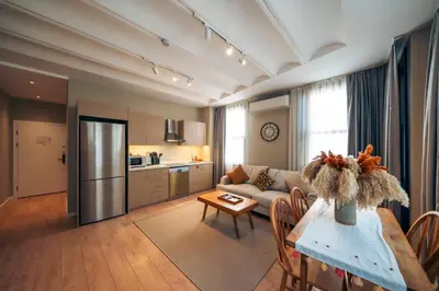 a living room with a couch and a table at Galata Guest Teori in Istanbul