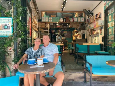 a man and woman sitting at a table in a restaurant at Balat Boutique Hotel in Istanbul