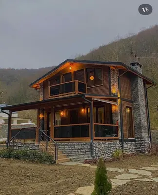 a large wooden house with a large window at Lal Hayal Konakları in Sapanca