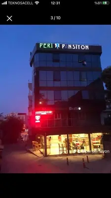 a building with a red light in front of it at Peri Pansiyon Butik Otel in Çınarcık