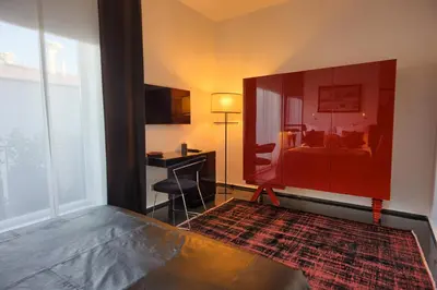 a room with a bedroom with a bed and a desk at Istanbul Irini Seaview House in Istanbul