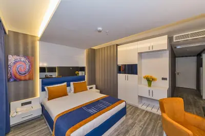 a hotel room with a bed and a chair at Inntel Hotel Istanbul in Istanbul