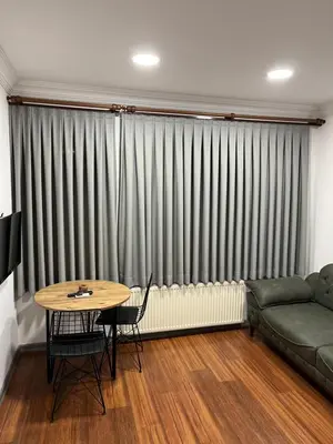 a living room with a couch and a table at Taksim Neo Pera Suites in Istanbul