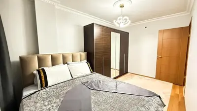 a bedroom with a large bed and a closet at Bomenti Sisli in Istanbul