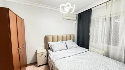 a bedroom with a bed and a window at Bomenti Sisli in Istanbul