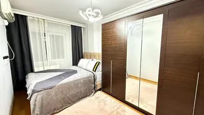 a bedroom with a bed and a glass closet at Bomenti Sisli in Istanbul