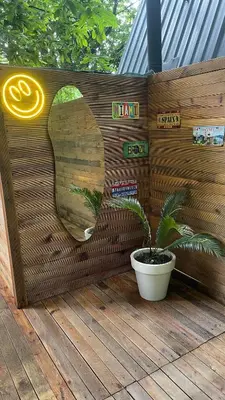 a wooden wall with a potted plant on a deck at Rcsapanca in Sapanca