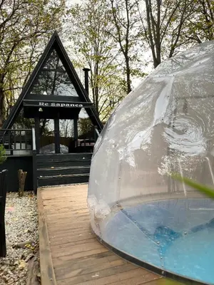 a large plastic dome sitting on top of a wooden deck at Wolf house in Sapanca