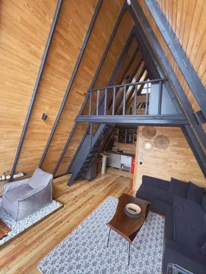 an attic room with a couch and a table at Wolf house in Sapanca
