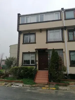 a white house with a brown door and windows at fuar VİLLA in Beylikduzu