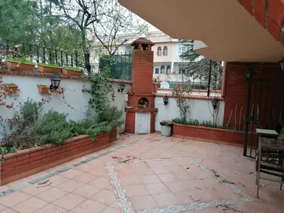 a courtyard of a house with a brick wall at fuar VİLLA in Beylikduzu