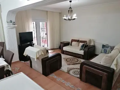 a living room filled with furniture and a chandelier at fuar VİLLA in Beylikduzu