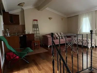a living room with a bed and a kitchen with at fuar VİLLA in Beylikduzu