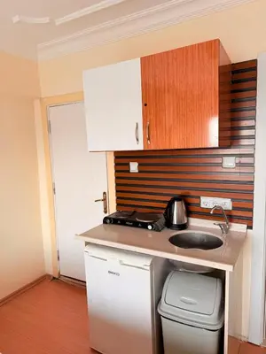 a small kitchen with a counter and a sink at Haliç Konaklama in Istanbul