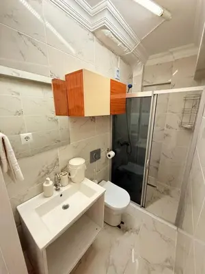 a bathroom with a sink and a toilet and a shower at Haliç Konaklama in Istanbul