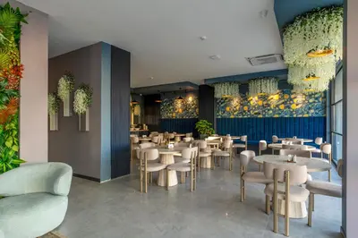 a restaurant with tables and chairs in a room at Dedem Hotel Premium - Çorlu in Corlu
