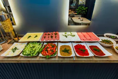 a buffet with different types of food on plates at Dedem Hotel Premium - Çorlu in Corlu