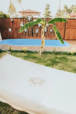 a surfboard sitting in front of a pool at The Jungle Sapanca in Sakarya