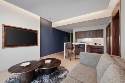 a living room with a couch and a table at GOLDEN TULIP GEBKIM KOCAELI in Kocaeli