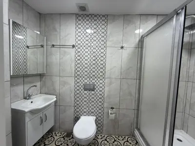 a bathroom with a shower and a toilet and a sink at Grand Bedir in Istanbul