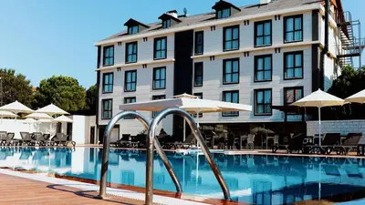 a hotel with a swimming pool in front of a building at Bohem Hotel in Beykoz