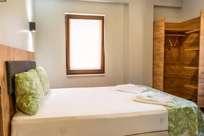 a bed with two towels on it in a room at İznik Seyir Otel in İznik