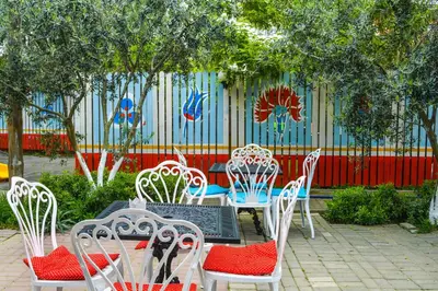 a group of chairs and a table in a garden at İznik Seyir Otel in İznik