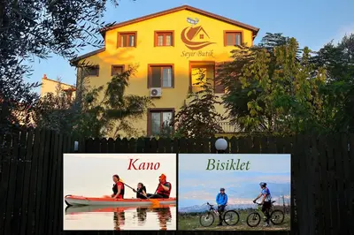 a sign in front of a building with people on a boat at İznik Seyir Otel in İznik