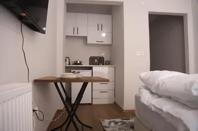 a small kitchen with a table in a room at Studios & Balat in Istanbul